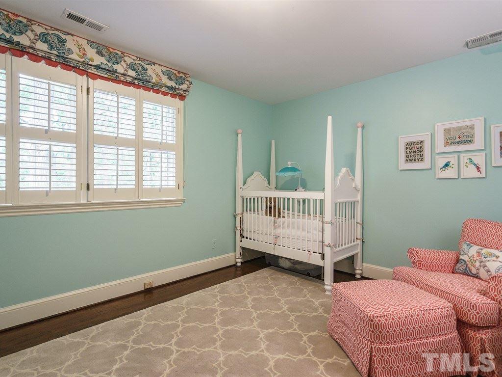 3116 Eton Road Raleigh, NC 27608 - Photo 20 of 25 a room with a bed and a window