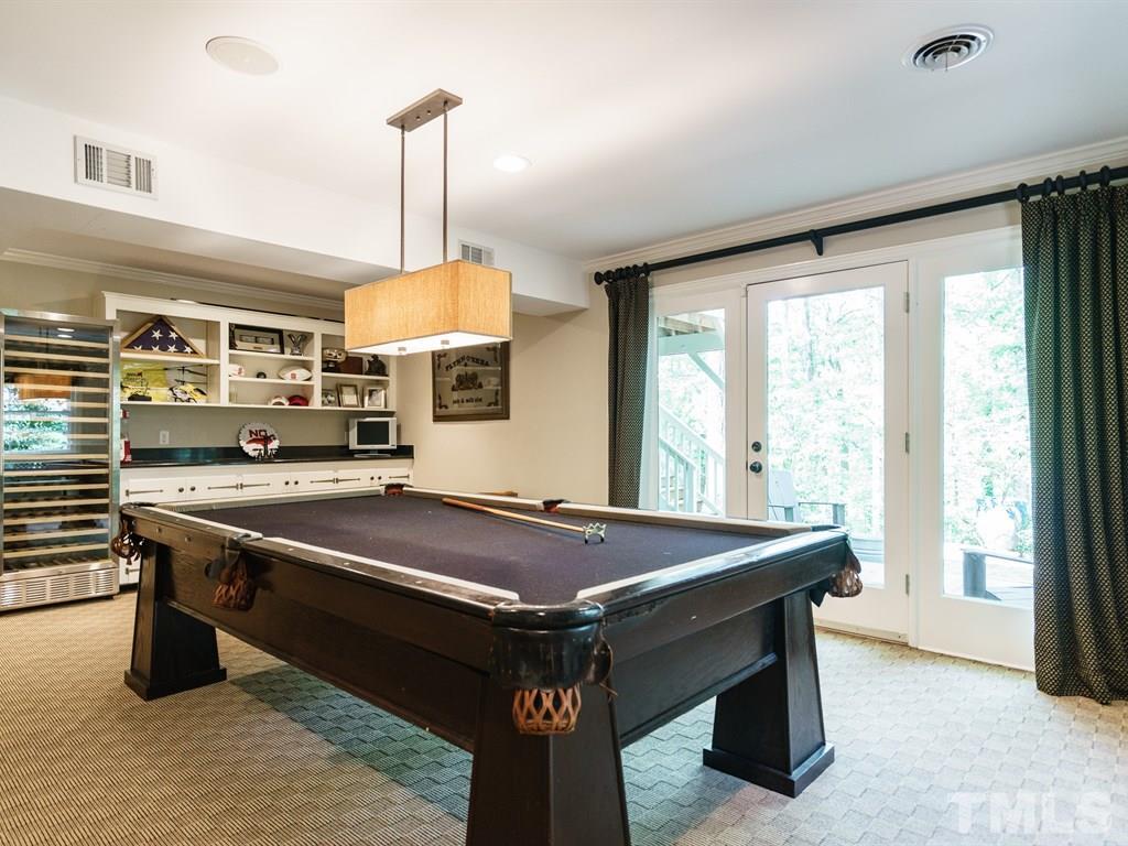 3116 Eton Road Raleigh, NC 27608 - Photo 21 of 25 a room with pool table and windows