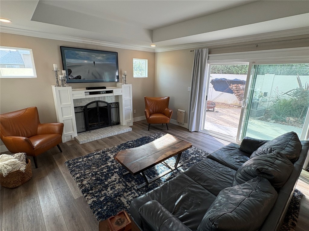 15471 Victoria Huntington Beach, CA 92647 - Photo 12 of 37 a living room with furniture fireplace and a flat screen tv
