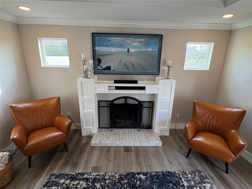 15471 Victoria Huntington Beach, CA 92647 - Photo 13 of 37 a living room with furniture and a fireplace