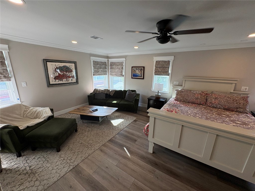 15471 Victoria Huntington Beach, CA 92647 - Photo 17 of 37 a bedroom with a bed couch and window