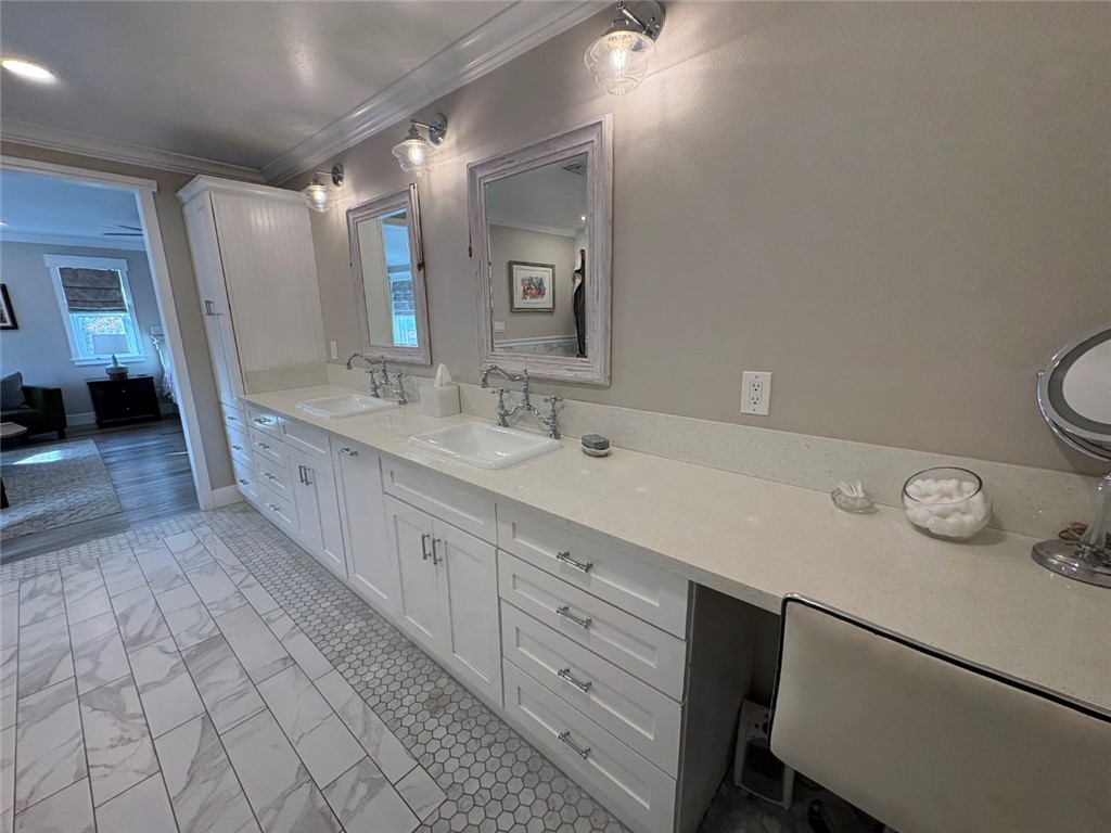 15471 Victoria Huntington Beach, CA 92647 - Photo 19 of 37 a spacious bathroom with a double vanity sink and a mirror