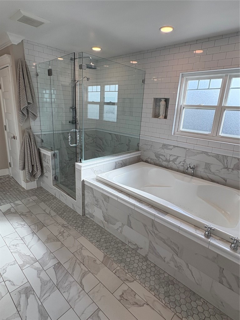 15471 Victoria Huntington Beach, CA 92647 - Photo 22 of 37 a bathroom with a bathtub and a shower