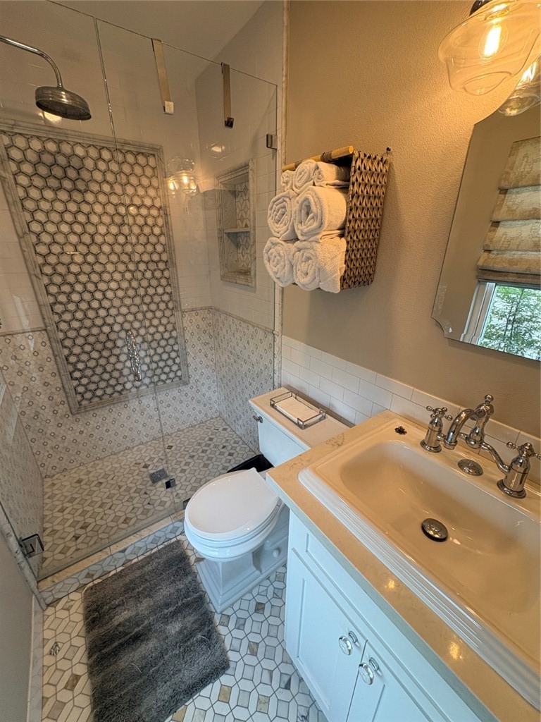 15471 Victoria Huntington Beach, CA 92647 - Photo 32 of 37 a bathroom with a sink toilet and shower
