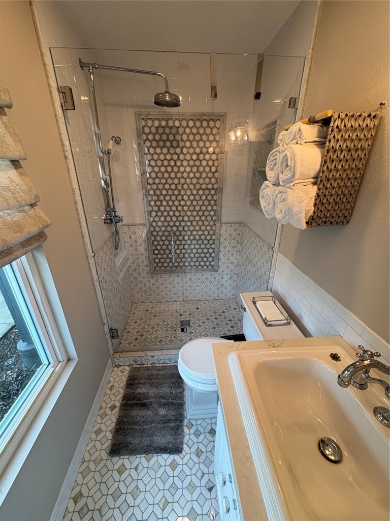 15471 Victoria Huntington Beach, CA 92647 - Photo 34 of 37 a bathroom with a sink a toilet and shower