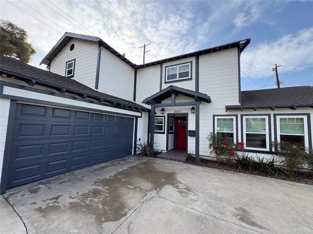 15471 Victoria Huntington Beach, CA 92647 - Photo 37 of 37 a front view of a house with a garage