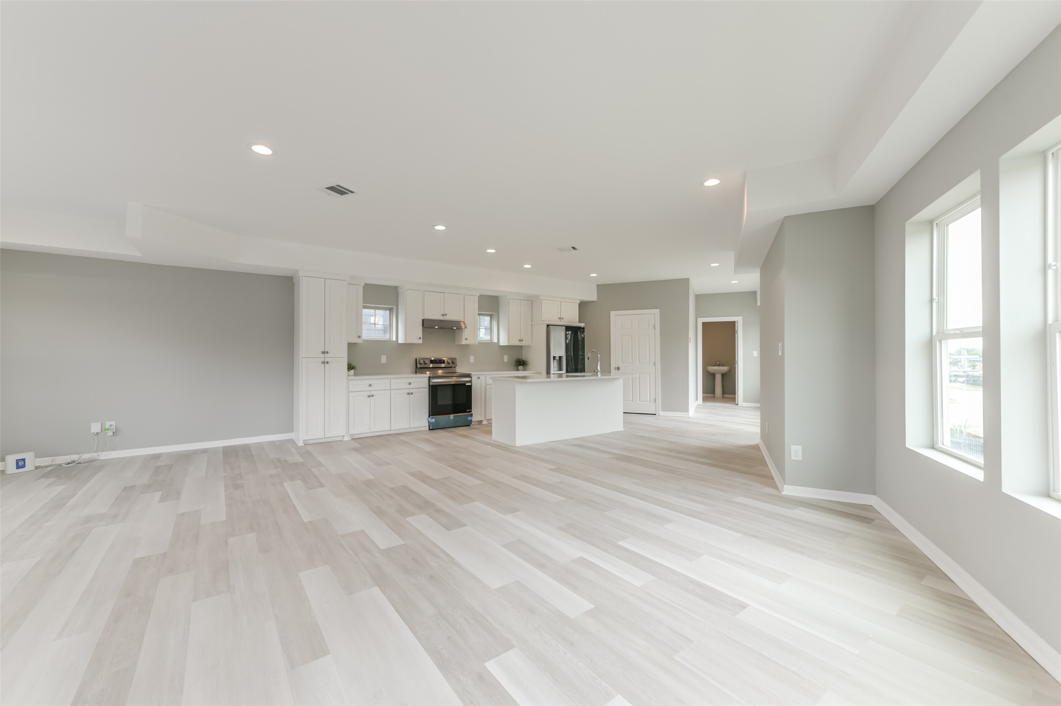 5302 Tarawa Road Houston, TX 77033 - Photo 11 of 35 a view of an empty room with kitchen and window