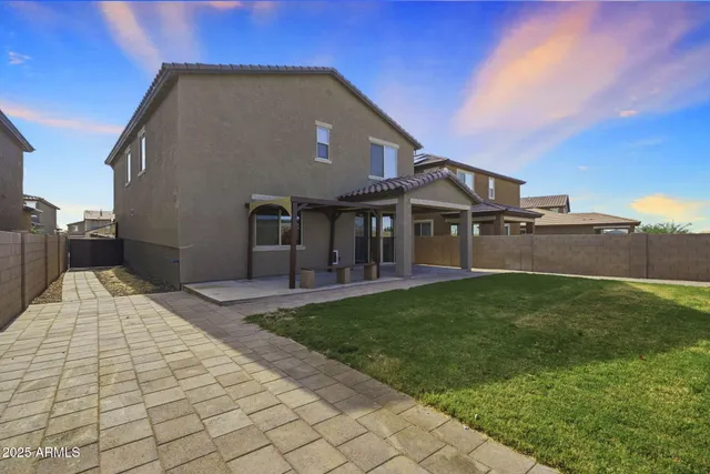 an aerial view of a house with a ocean view