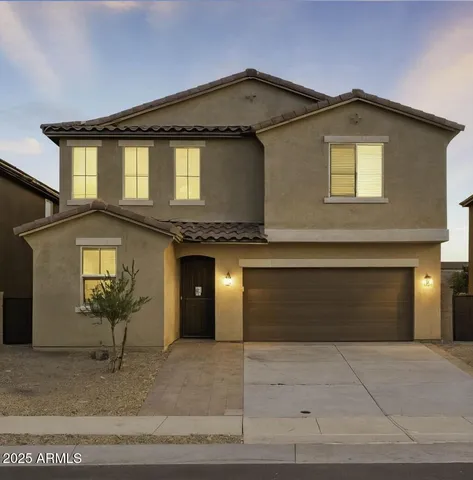a view of a house with a yard and sitting area