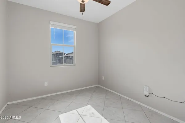 a kitchen with granite countertop a stove top oven microwave and cabinets