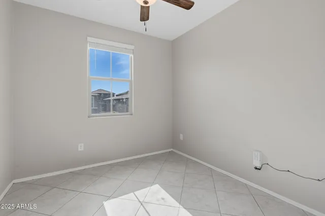 a kitchen with granite countertop a stove top oven microwave and cabinets