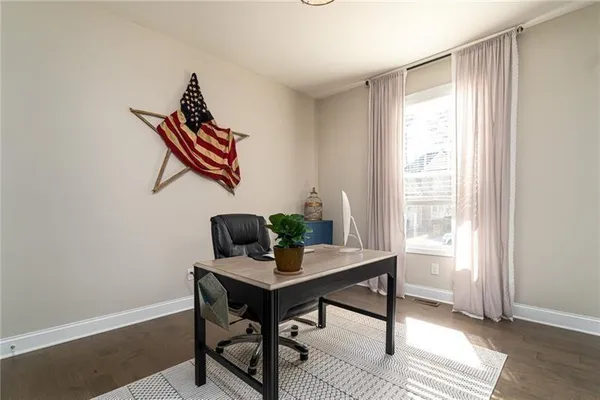 a workspace with furniture and window