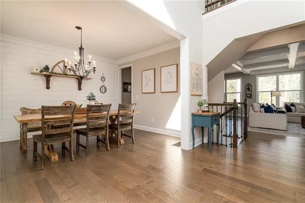 a view of a dining room with furniture window and wooden floor