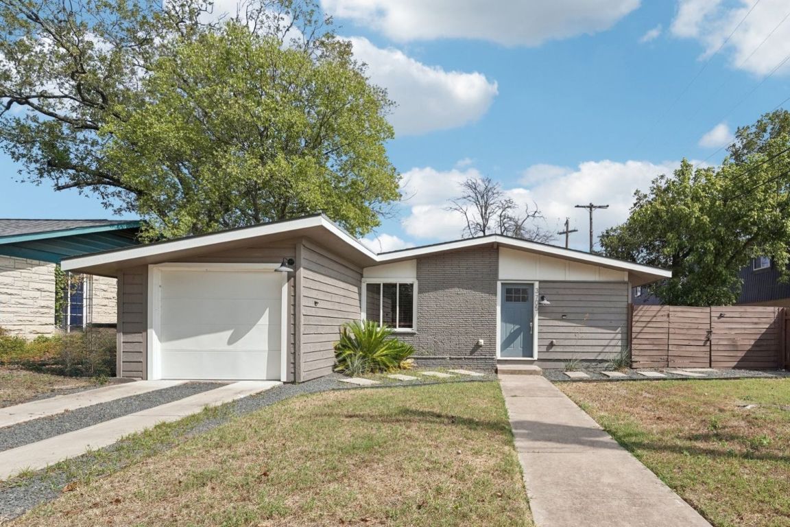 3705 Manorwood Road Austin, TX 78723 - Photo 1 of 16 a front view of a house with garden