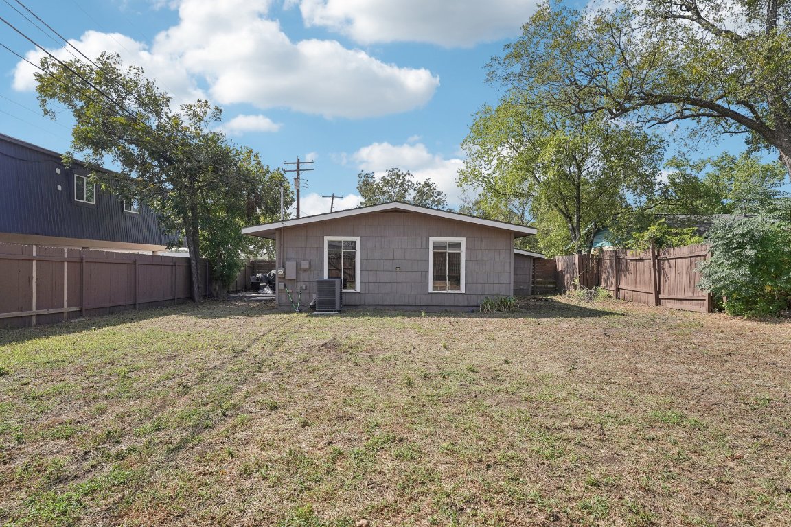 3705 Manorwood Road Austin, TX 78723 - Photo 14 of 16 a house with trees in front of it