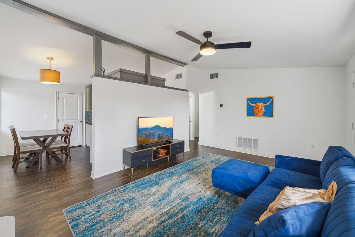 3705 Manorwood Road Austin, TX 78723 - Photo 4 of 16 a living room with furniture and a flat screen tv