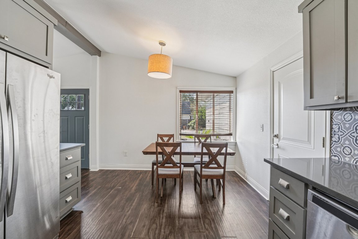 3705 Manorwood Road Austin, TX 78723 - Photo 7 of 16 a view of a dining room with furniture and wooden floor