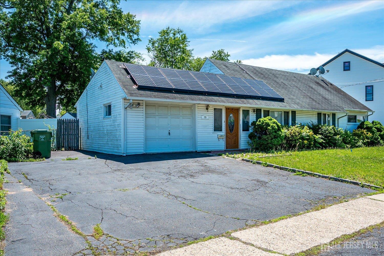 15 Markham Road Edison, NJ 08817 - Photo 3 of 32 a house view with a garden space