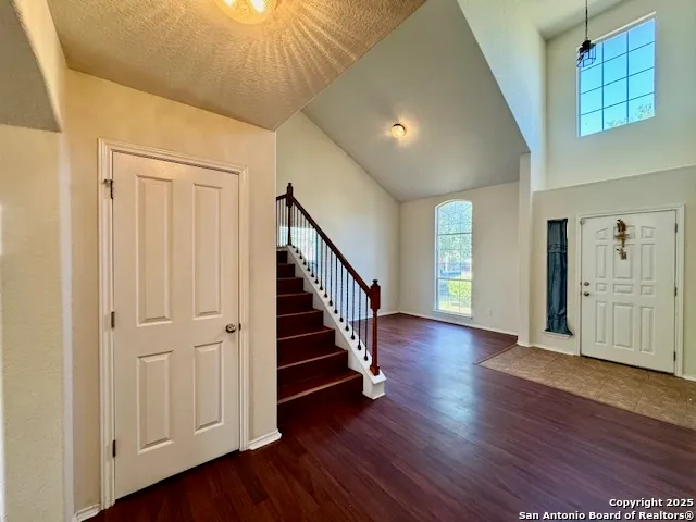 a view of an entryway with wooden floor