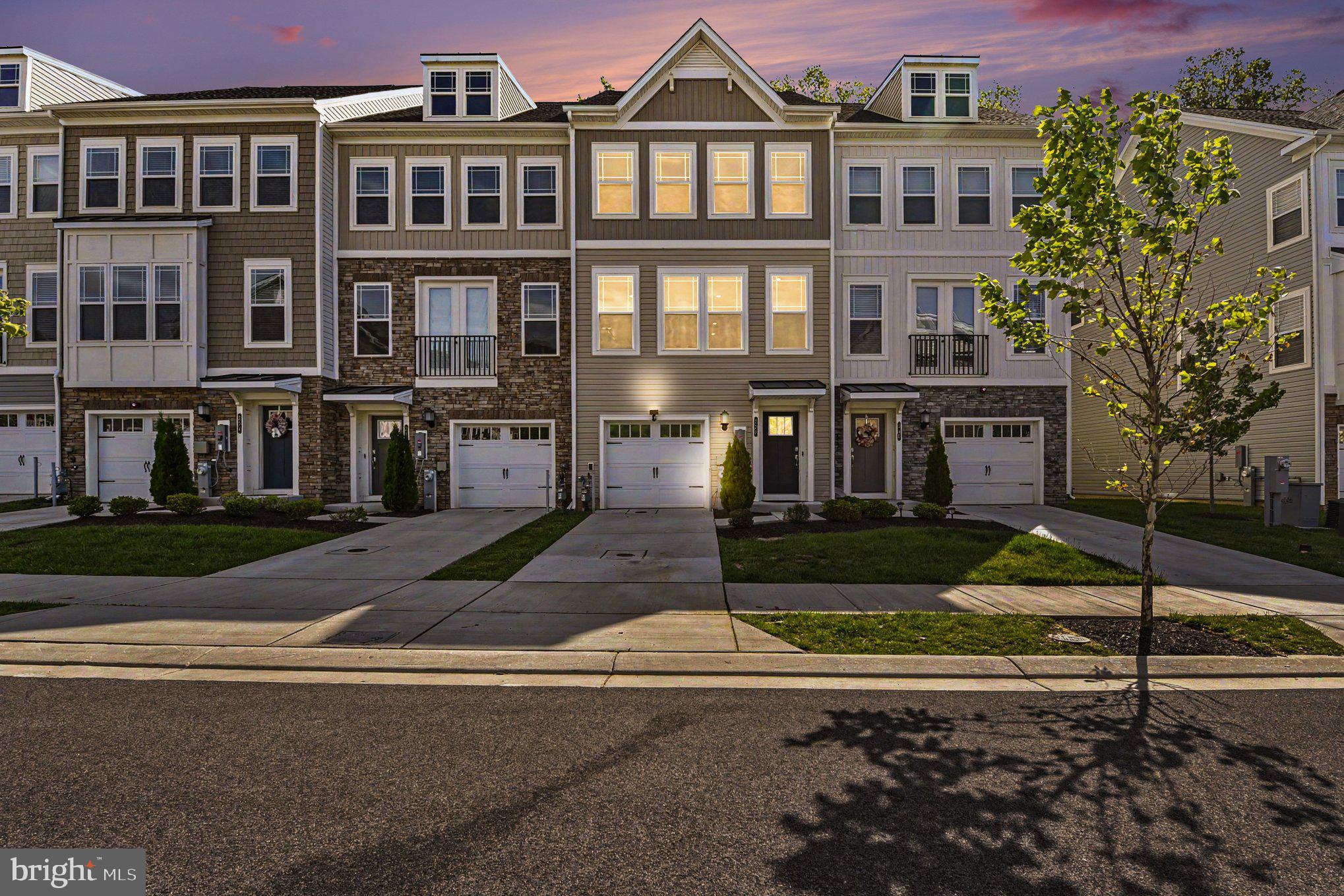 238 Waterstone Road Essex, MD 21221 - Photo 1 of 39 a front view of a residential apartment building with a yard