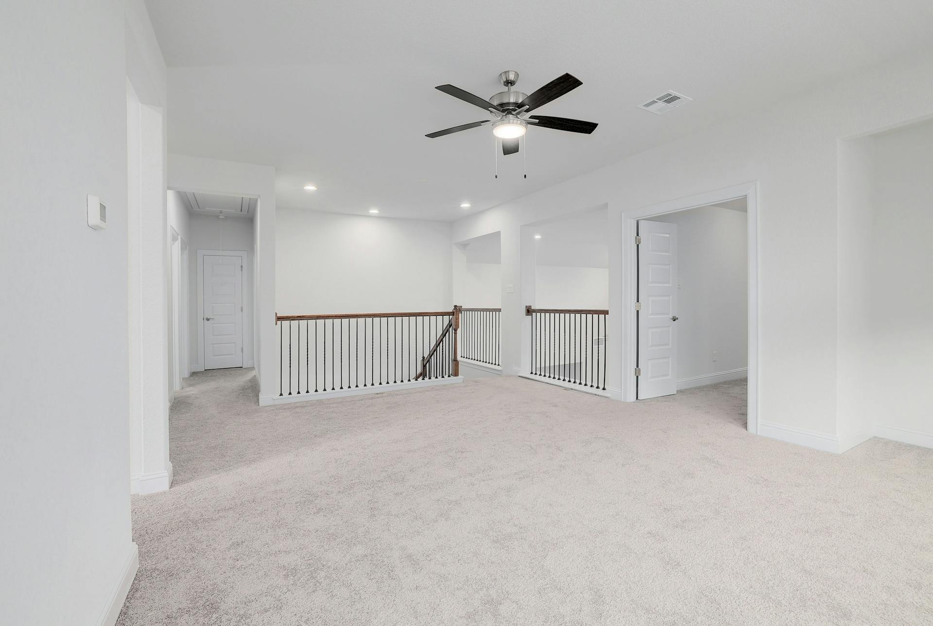 2040 Base Burner Path Leander, TX 78641 - Photo 17 of 31 Empty room featuring light carpet, ceiling fan, and recessed lighting