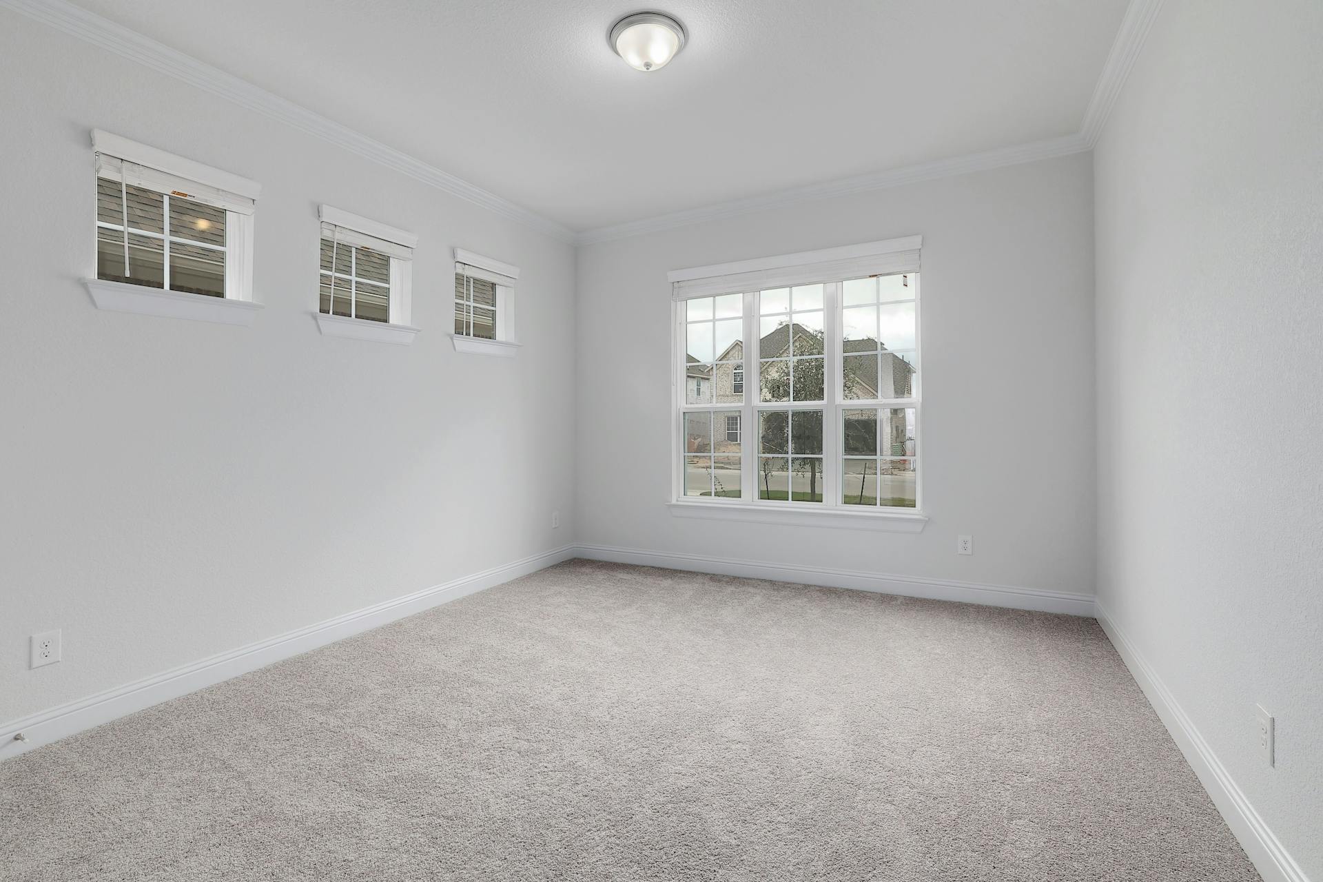 2040 Base Burner Path Leander, TX 78641 - Photo 19 of 31 Unfurnished room featuring light carpet and crown molding