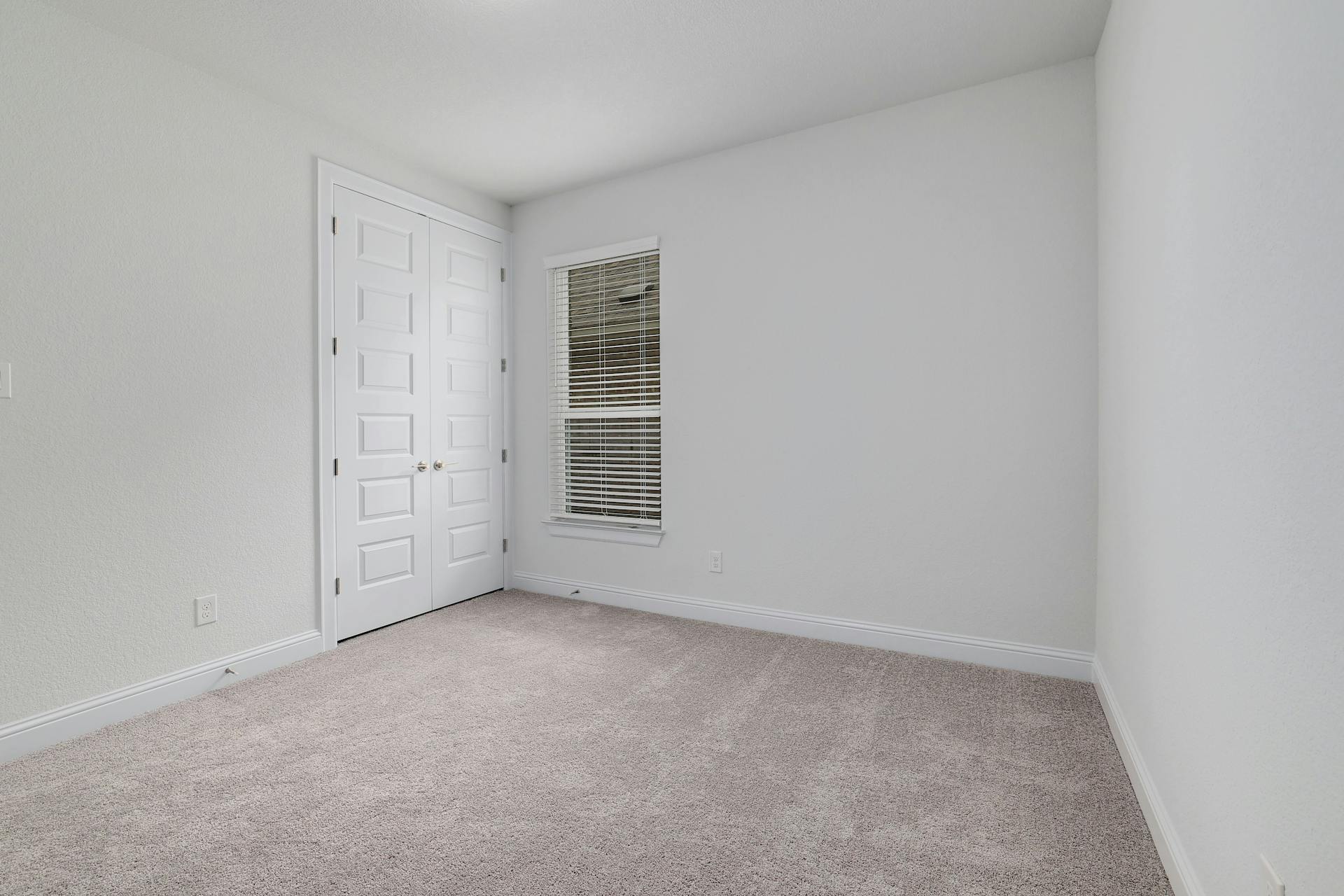 2040 Base Burner Path Leander, TX 78641 - Photo 25 of 31 Unfurnished bedroom featuring light colored carpet and a closet