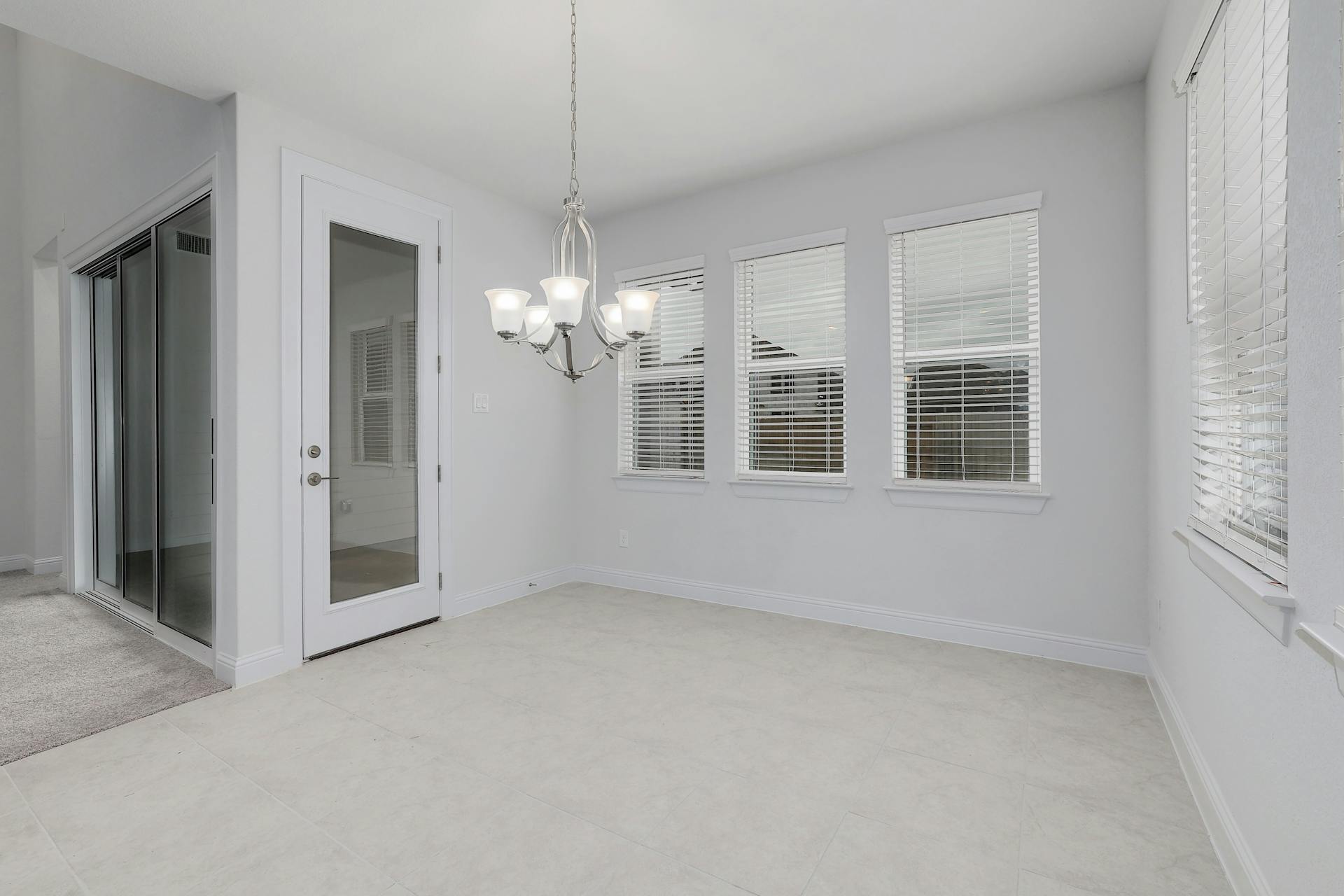 2040 Base Burner Path Leander, TX 78641 - Photo 7 of 31 Unfurnished dining area featuring baseboards and suspended lighting