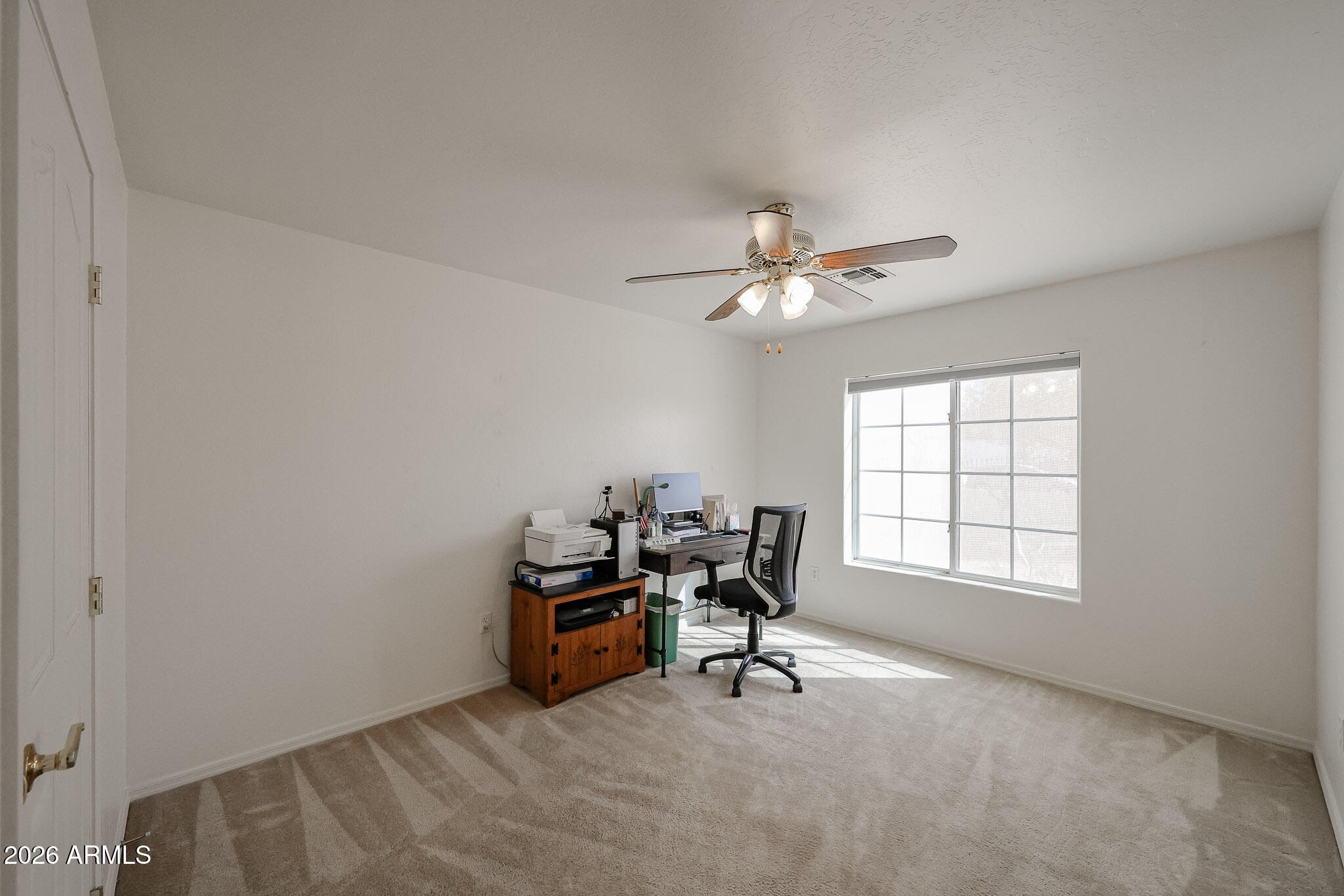 14980 South Capistrano Road Arizona City, AZ 85123 - Photo 21 of 39 a view of a workspace with furniture and a window