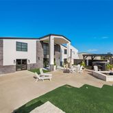 a view of a house with sitting area and furniture