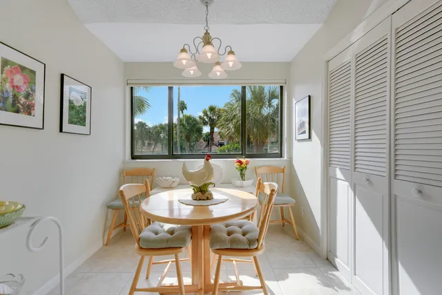 a view of a dining room with furniture window and outside view