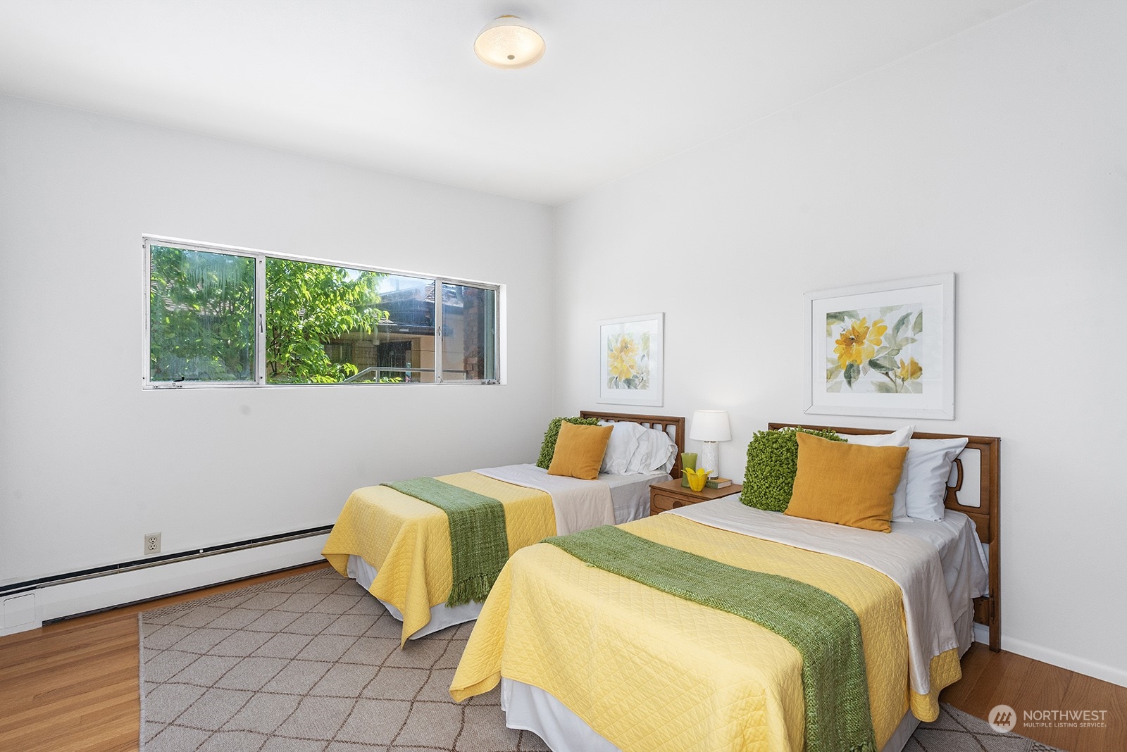3513 West Howe Street Seattle, WA 98199 - Photo 15 of 39 a bedroom with two beds and a painting on the wall