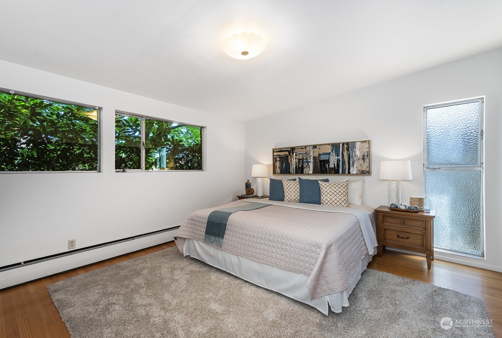 3513 West Howe Street Seattle, WA 98199 - Photo 17 of 39 a bedroom with a bed lamp closet and window