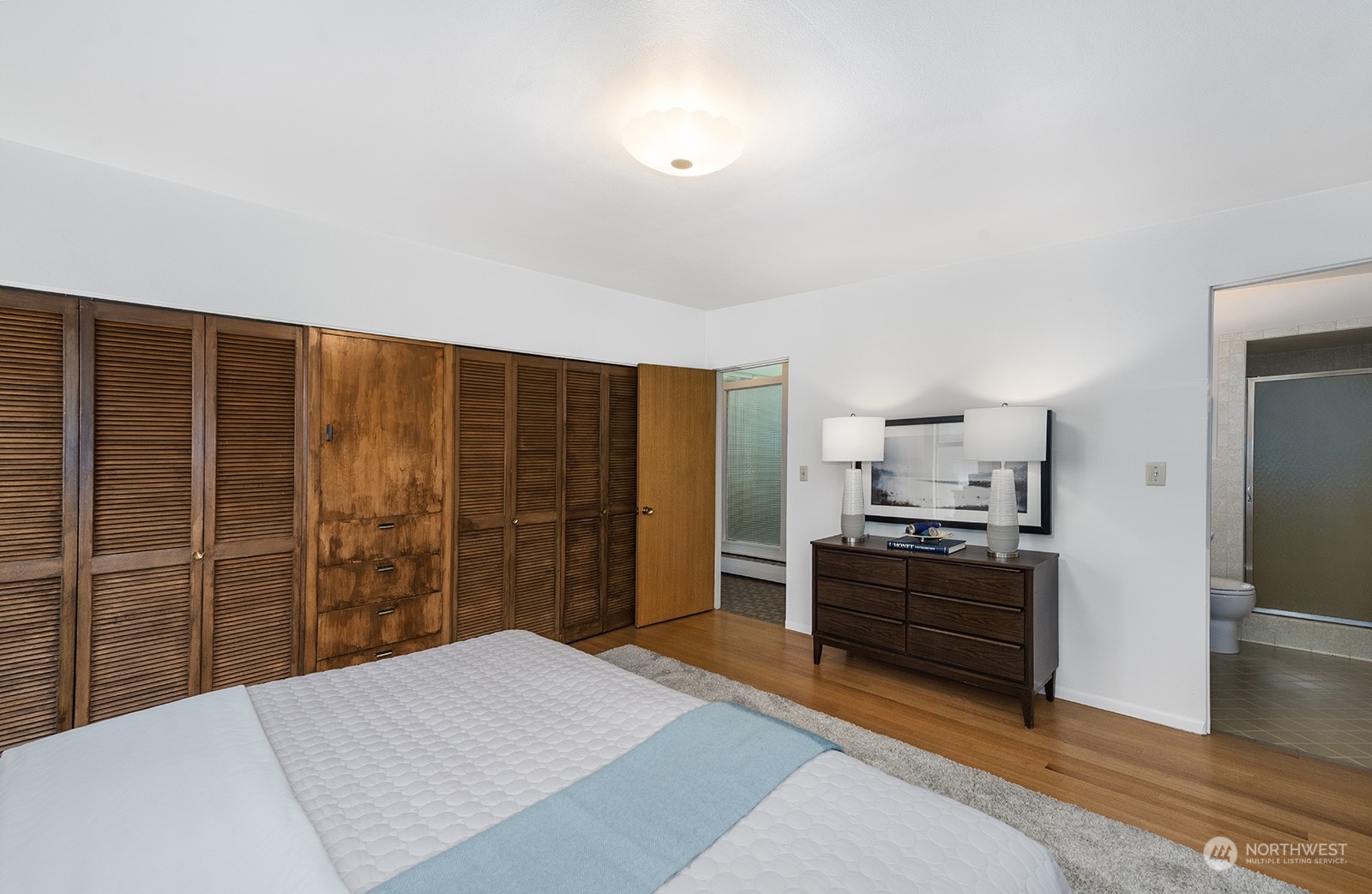 3513 West Howe Street Seattle, WA 98199 - Photo 18 of 39 a kitchen with stainless steel appliances kitchen island granite countertop a refrigerator and a stove top oven