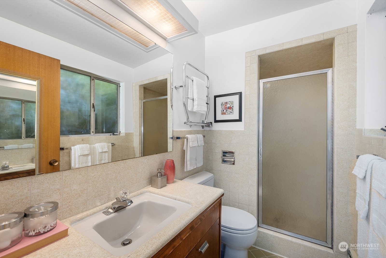 3513 West Howe Street Seattle, WA 98199 - Photo 19 of 39 a bathroom with a sink toilet and shower