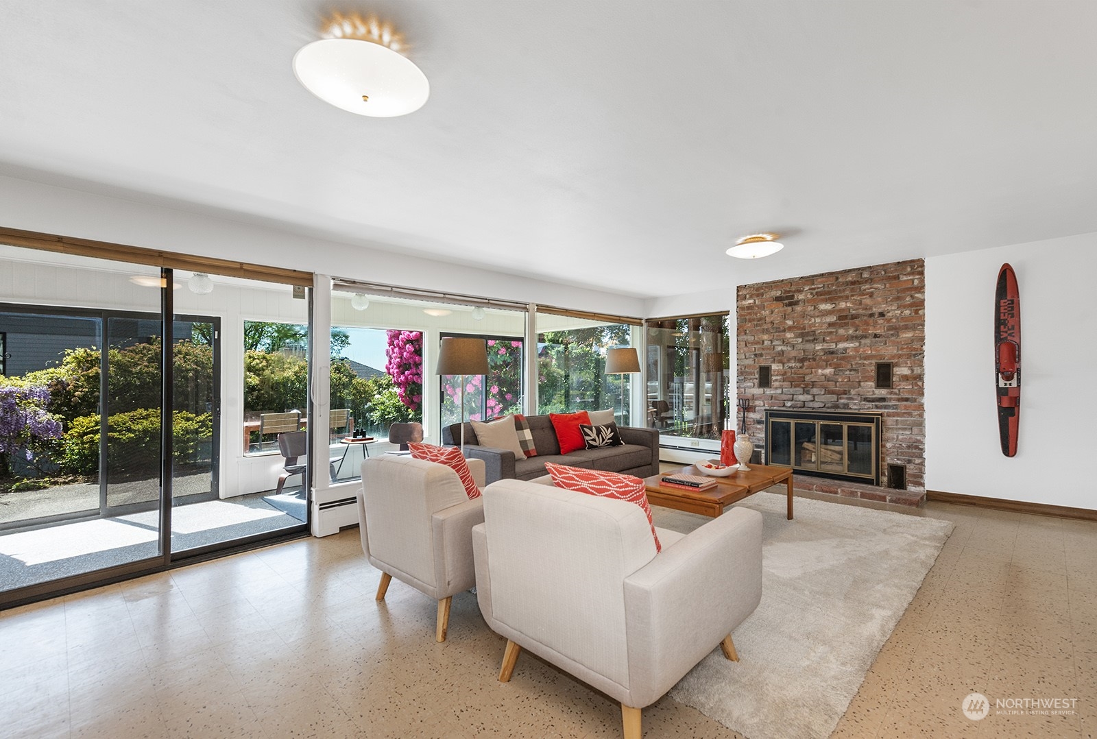 3513 West Howe Street Seattle, WA 98199 - Photo 20 of 39 a living room with fireplace furniture and a floor to ceiling window