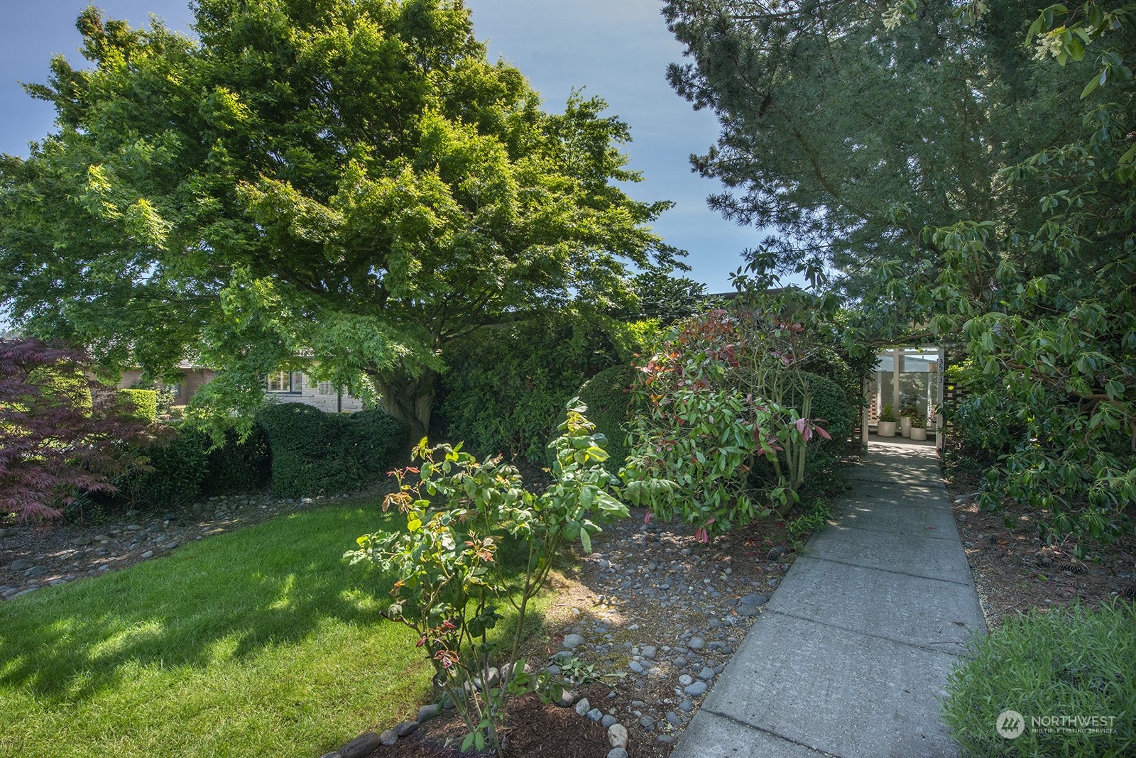 3513 West Howe Street Seattle, WA 98199 - Photo 2 of 39 a view of a garden with plants