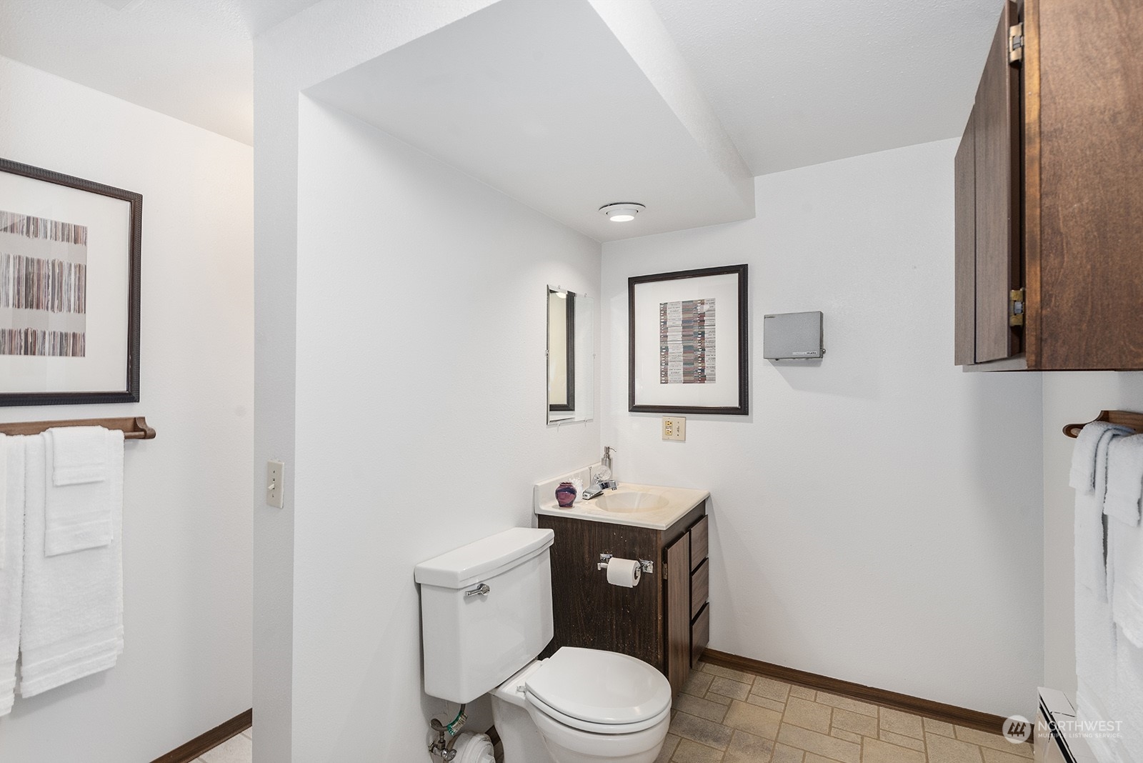 3513 West Howe Street Seattle, WA 98199 - Photo 28 of 39 a white toilet sitting next to a bathroom sink