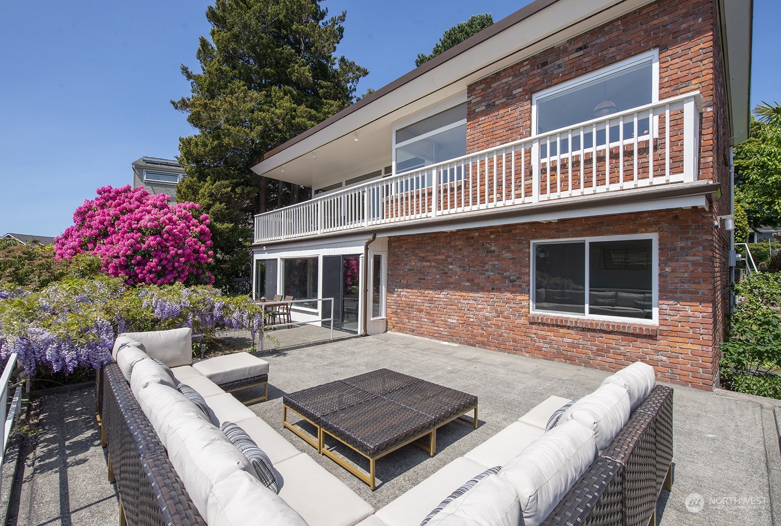 3513 West Howe Street Seattle, WA 98199 - Photo 32 of 39 a view of house with backyard and sitting area