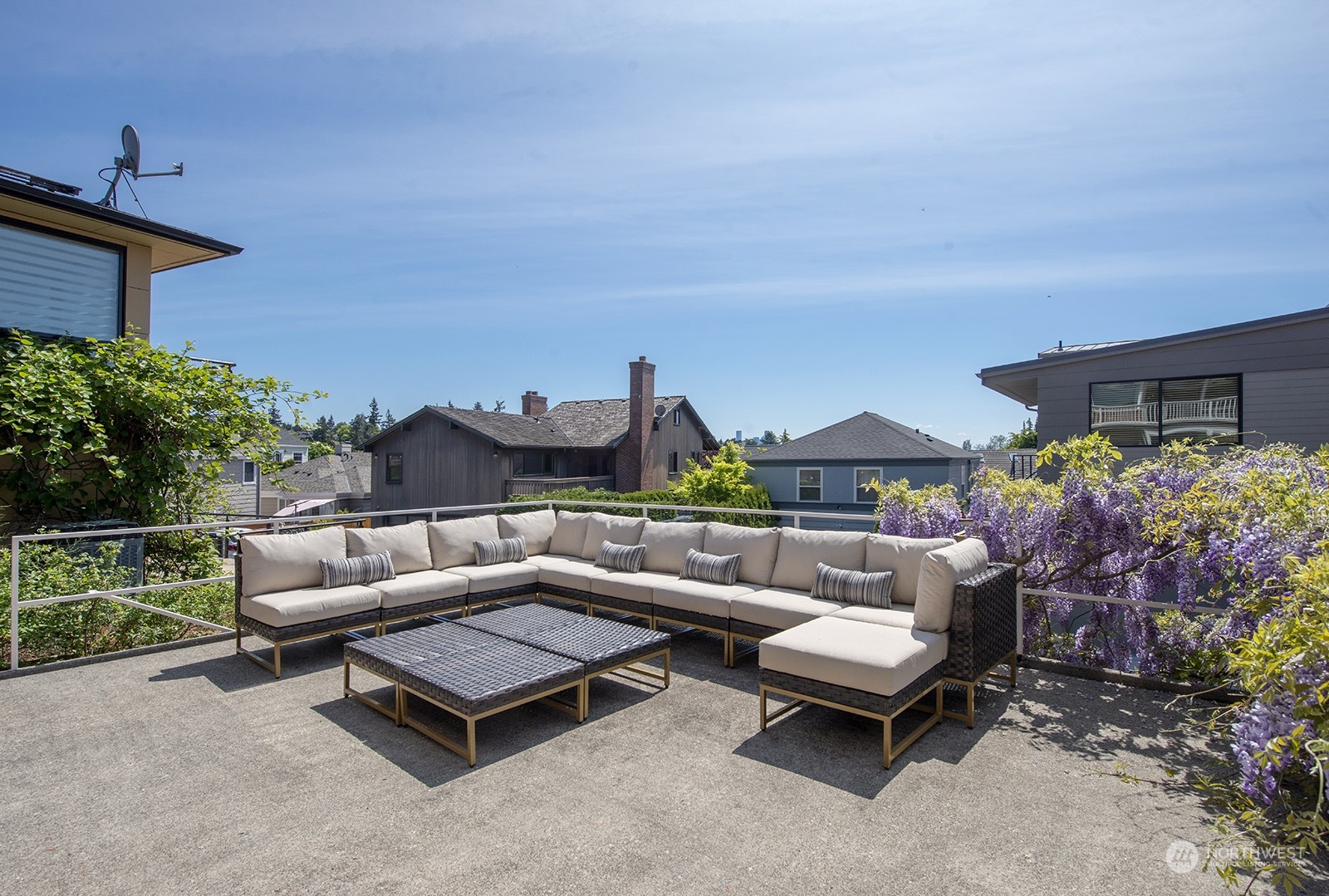 3513 West Howe Street Seattle, WA 98199 - Photo 33 of 39 a view of a patio with couches and potted plants