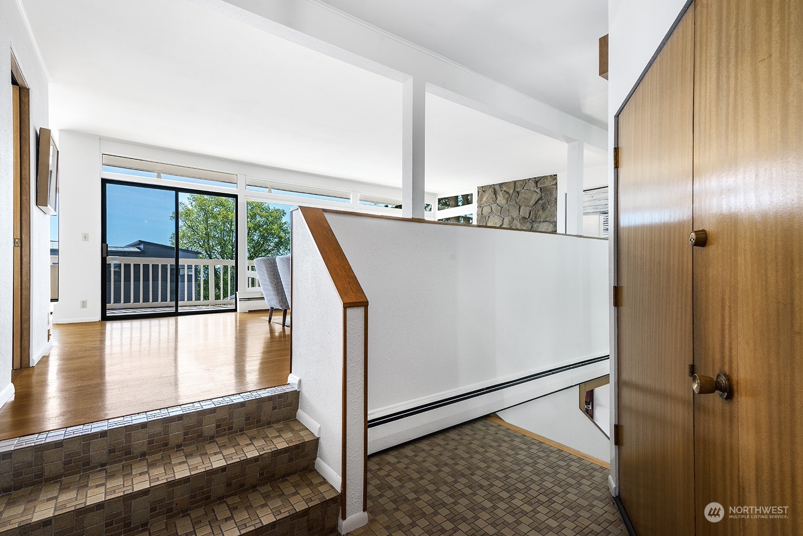 3513 West Howe Street Seattle, WA 98199 - Photo 4 of 39 a view of a hallway with wooden floor and staircase