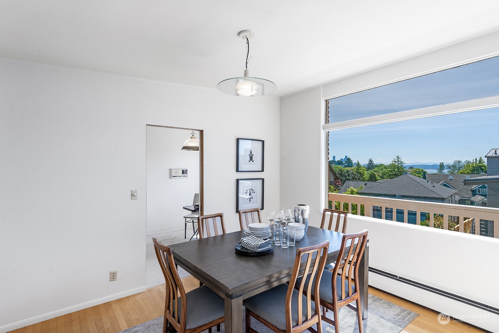 3513 West Howe Street Seattle, WA 98199 - Photo 8 of 39 a view of a dining room with furniture window and wooden floor