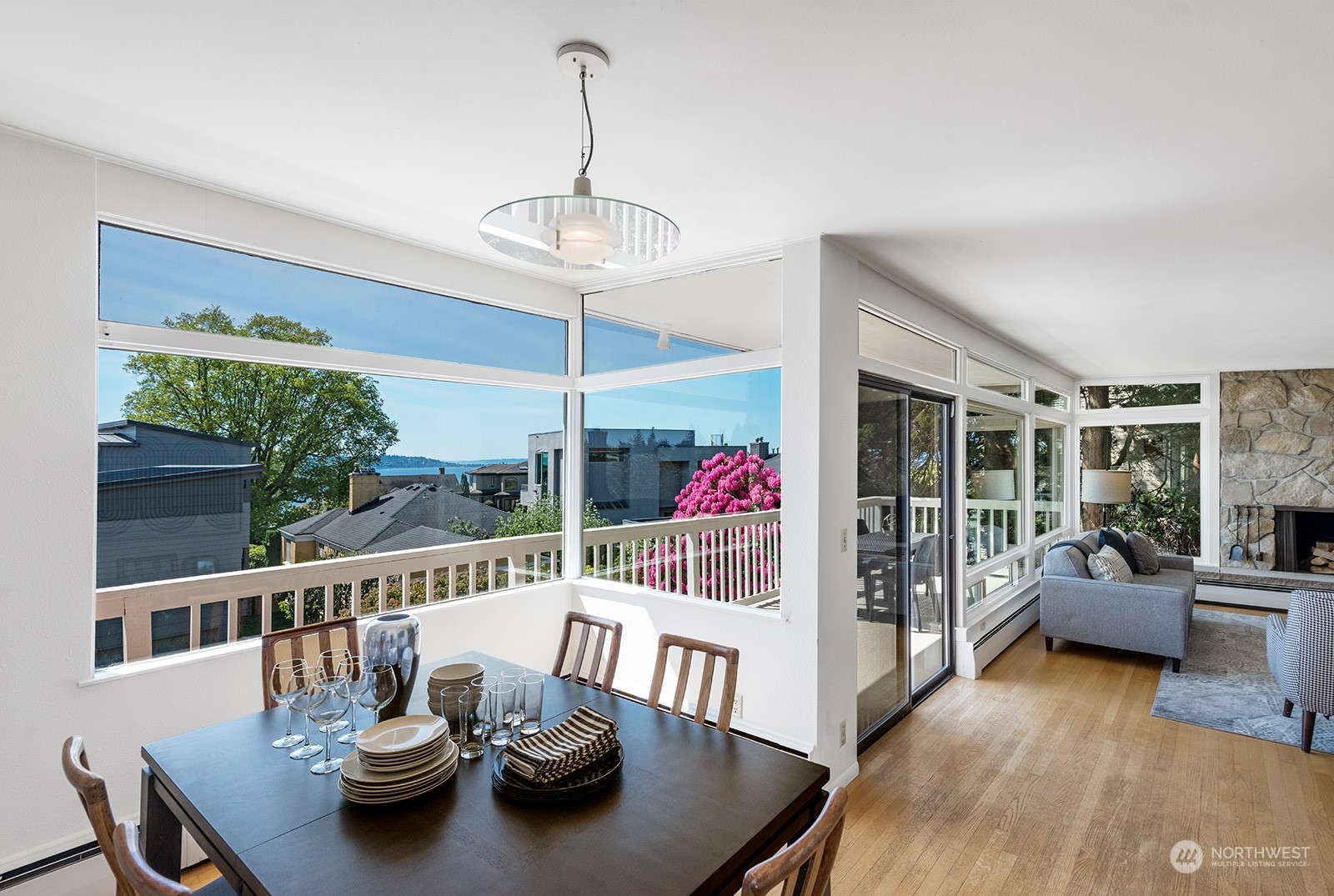 3513 West Howe Street Seattle, WA 98199 - Photo 9 of 39 a living room with furniture and a chandelier