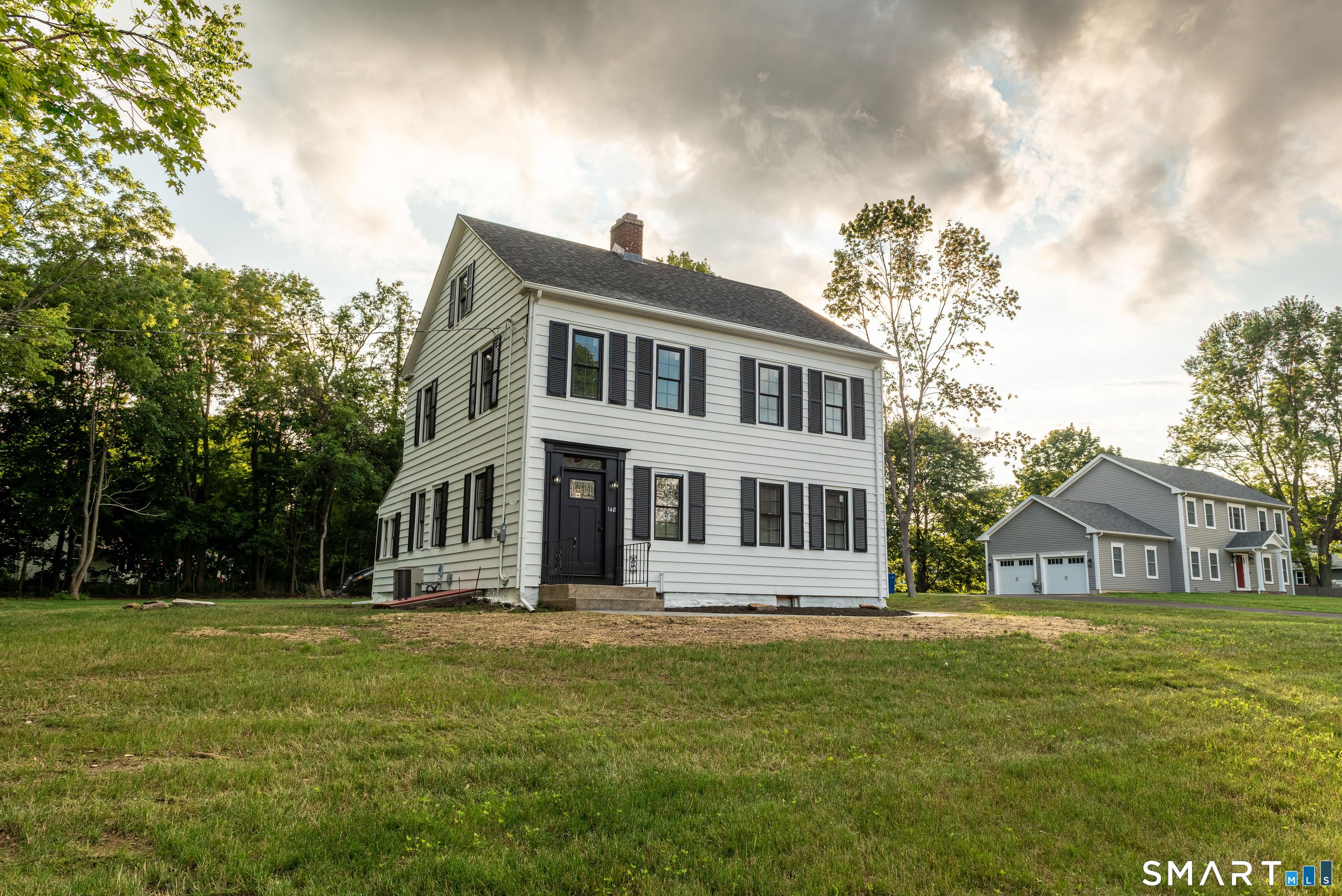 Classic 1920 Colonial, fully renovated, on a level 0.76-acre lot