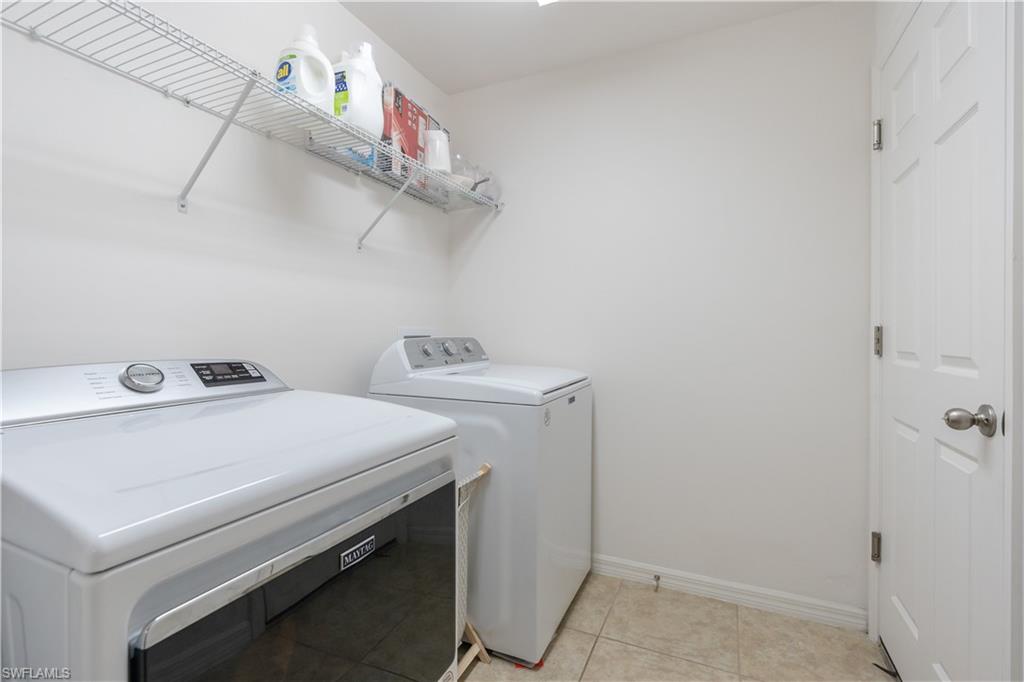 727 Morningview Court Lehigh Acres, FL 33974 - Photo 24 of 40 a utility room with dryer and washer