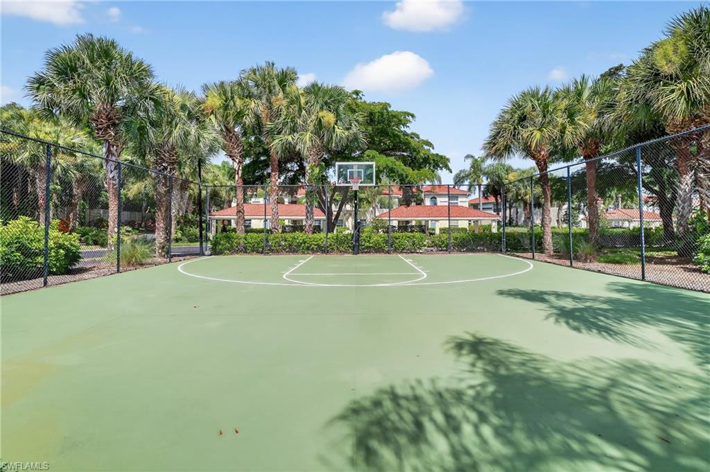 23800 Costa Del Sol Road, Unit 102 Estero, FL 34135 - Photo 36 of 49 a view of a playground with basketball court