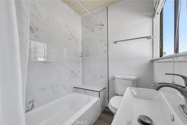 a bathroom with a sink and a bath tub