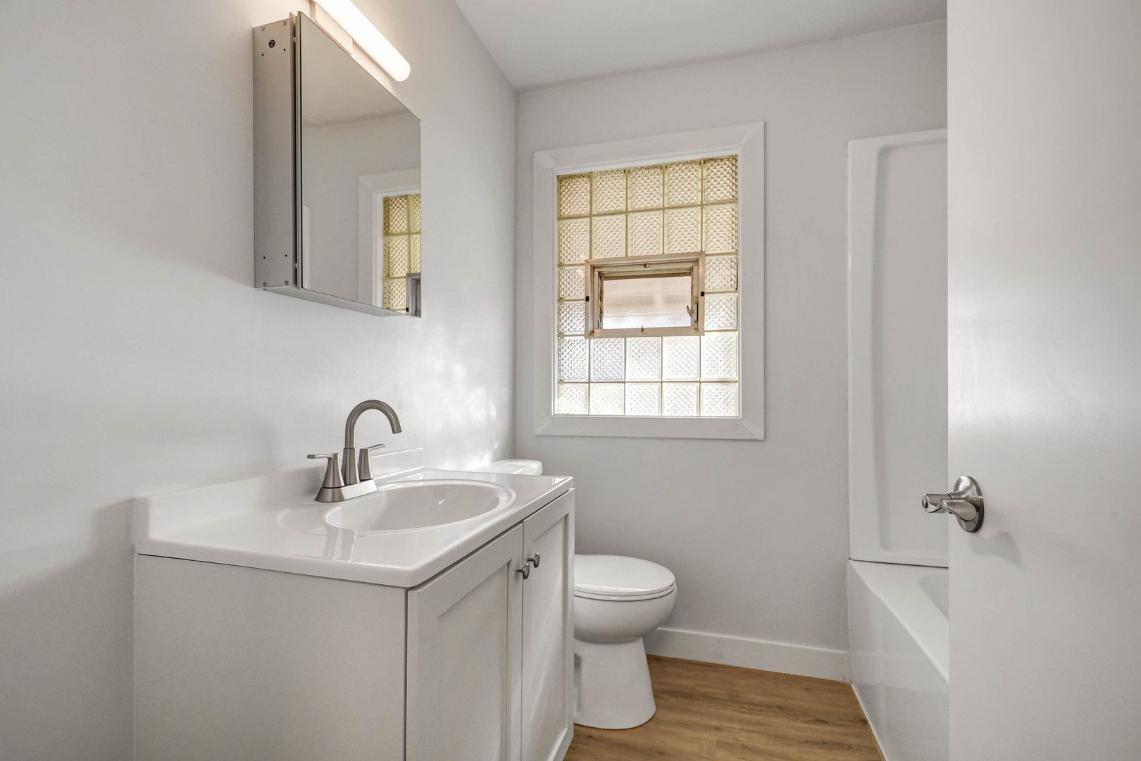 10313 South Church Street Chicago, IL 60643 - Photo 20 of 27 a bathroom with a sink toilet and vanity