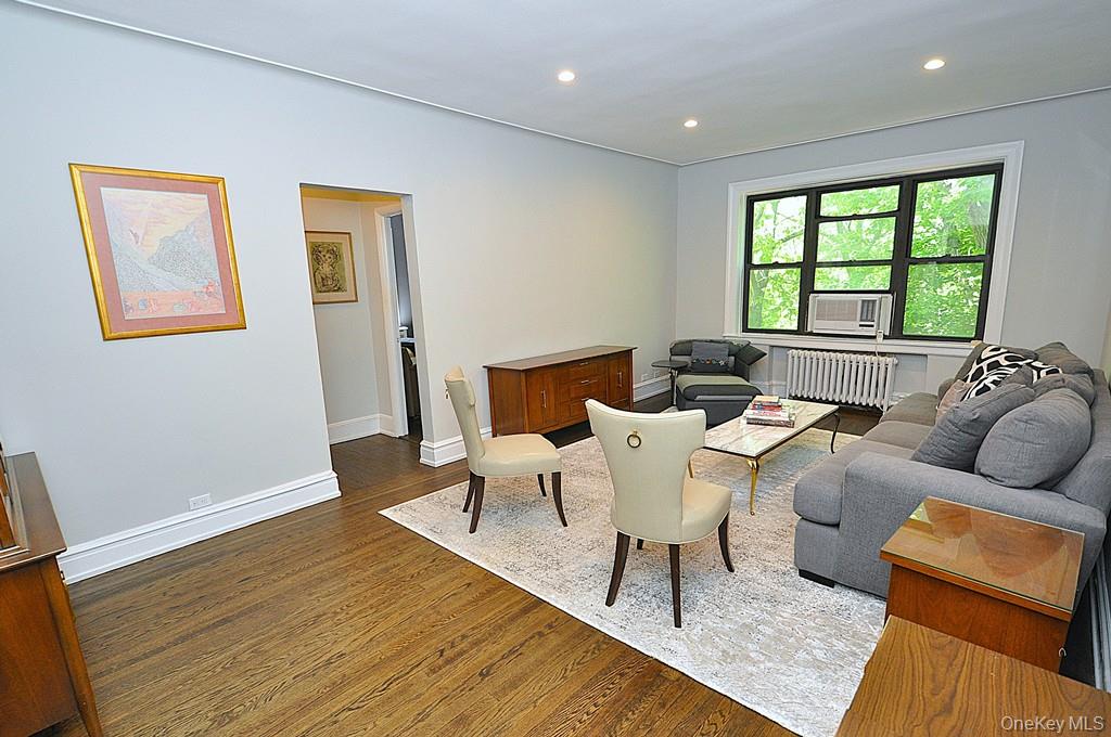 143 Garth Road, Unit 4P Scarsdale, NY 10583 - Photo 6 of 44 Bright and Sunny living room overlooks Garth Woods and has recessed lighting and hardwood floors.