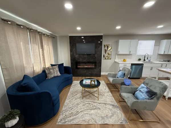 a living room with furniture and a flat screen tv
